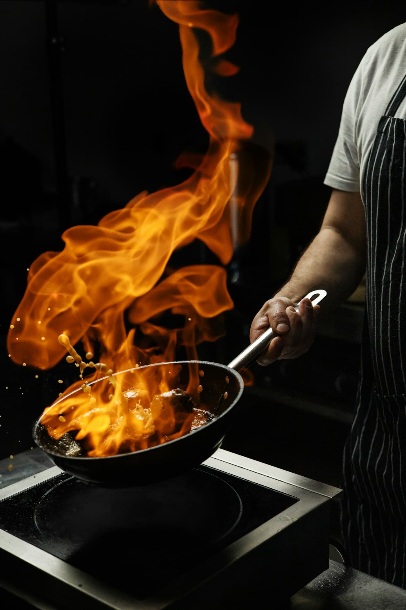 Flames rising from a wok