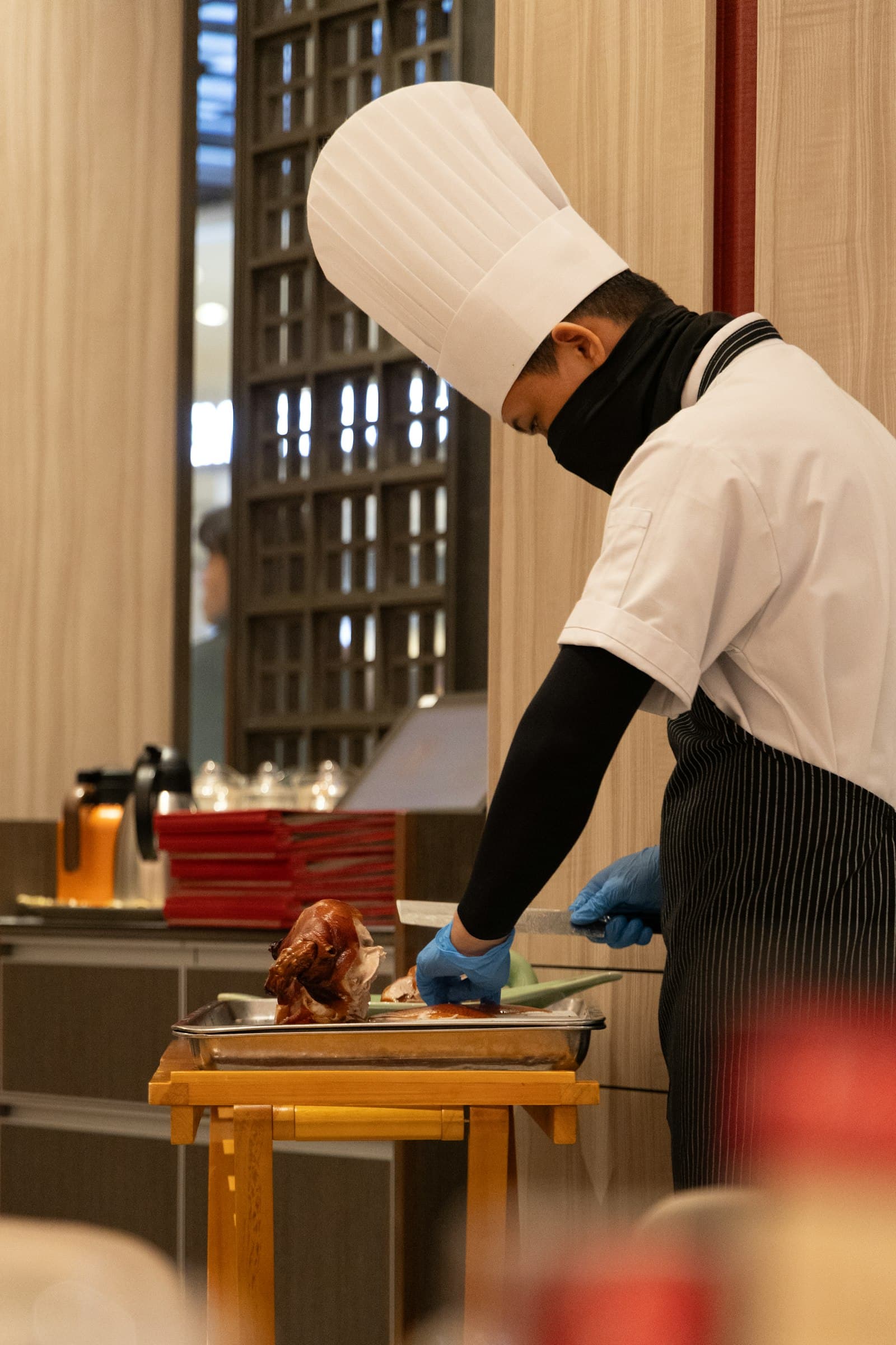 A chef preparing food at the pass