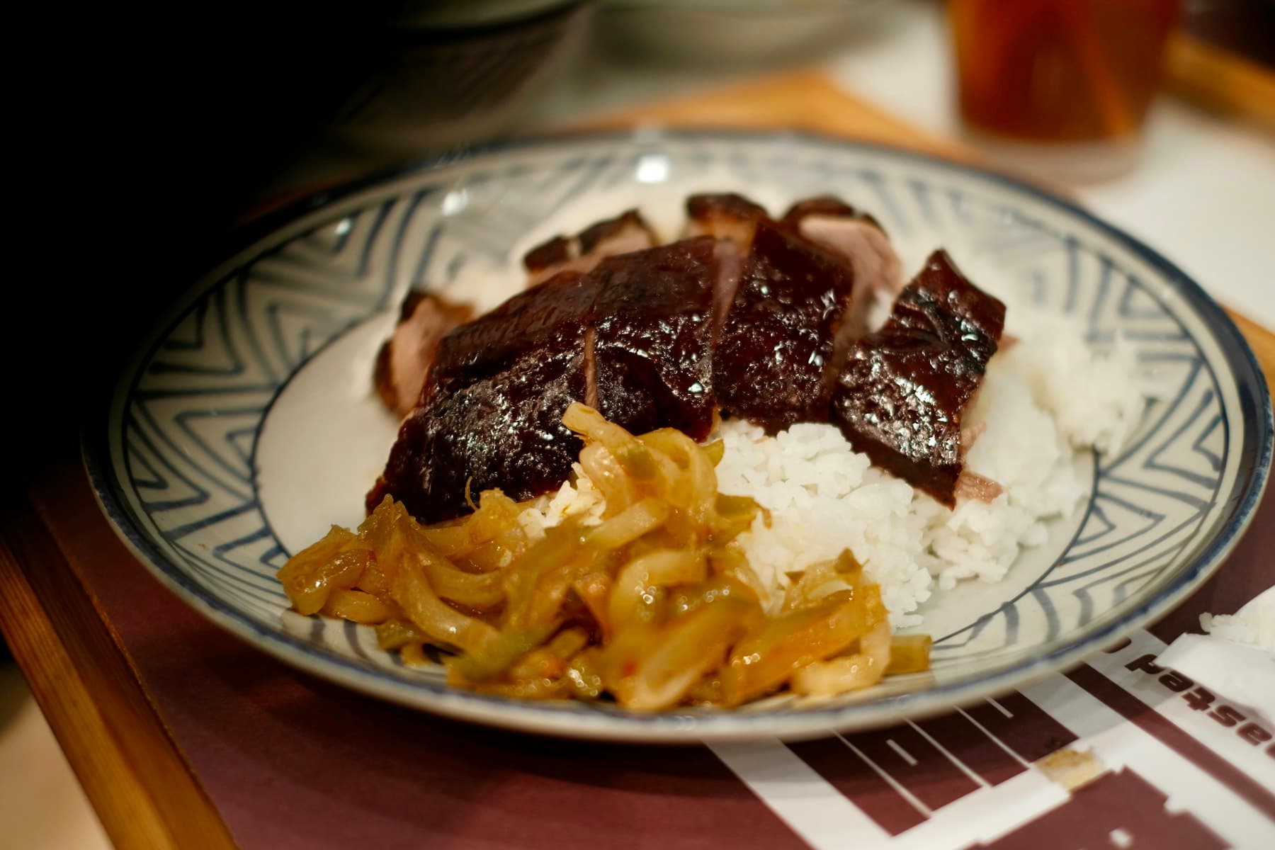 Sliced aromatic duck served with rice and pickled vegetables