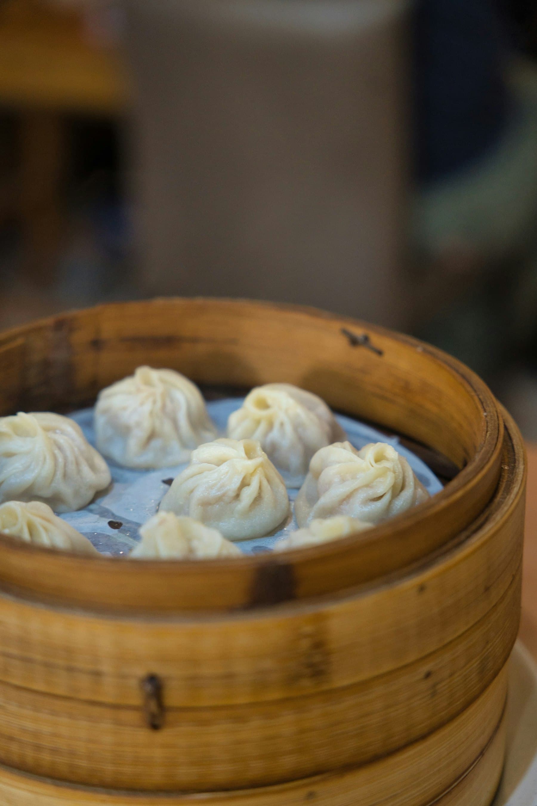 Dumplings in a bamboo steamer basket