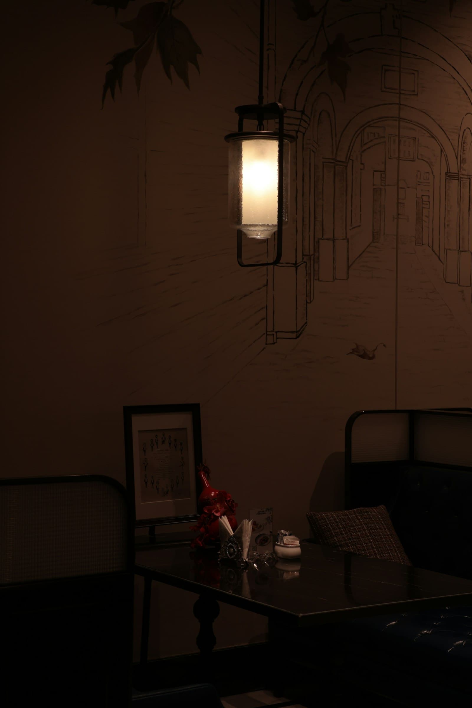 A lantern glowing in the dining room